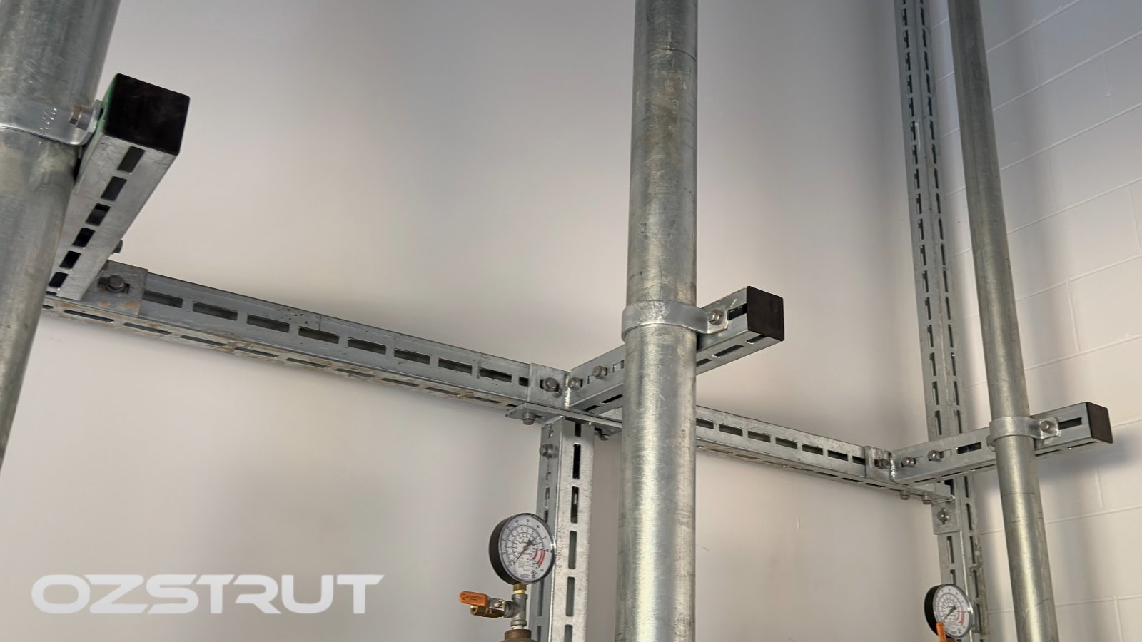 Heavy duty modular framing arranged around vertical pipework